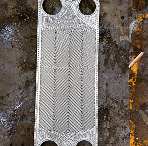 Plate heat-exchanger cleaning after treatment