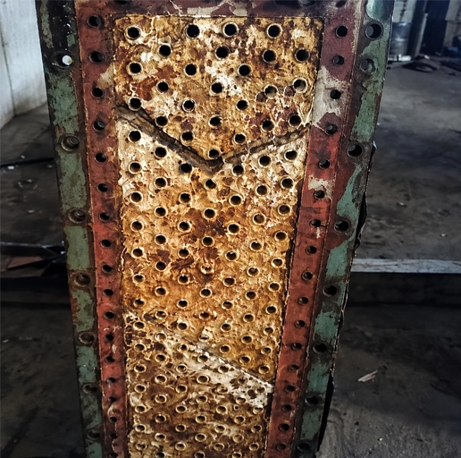 Heat-exchanger tube-sheet cleaning before treatment